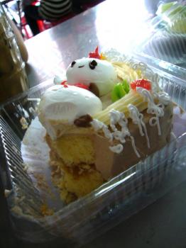 Yellow cake with fruit filling and buttercream frosting